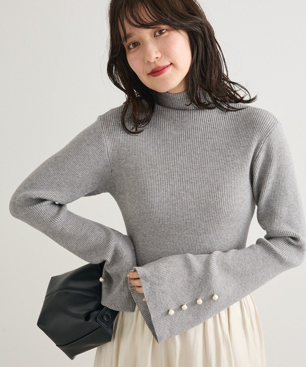 Green Parks ・ｓｗｉｎｇ　ｂｙ　袖パールボタンフレアリブニット 