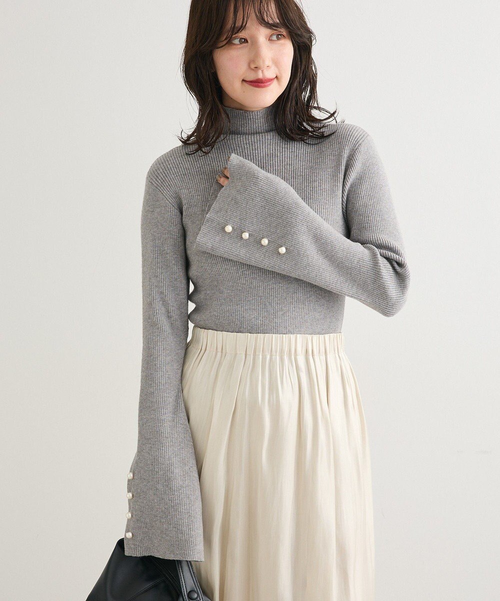 Green Parks ・ｓｗｉｎｇ　ｂｙ　袖パールボタンフレアリブニット 