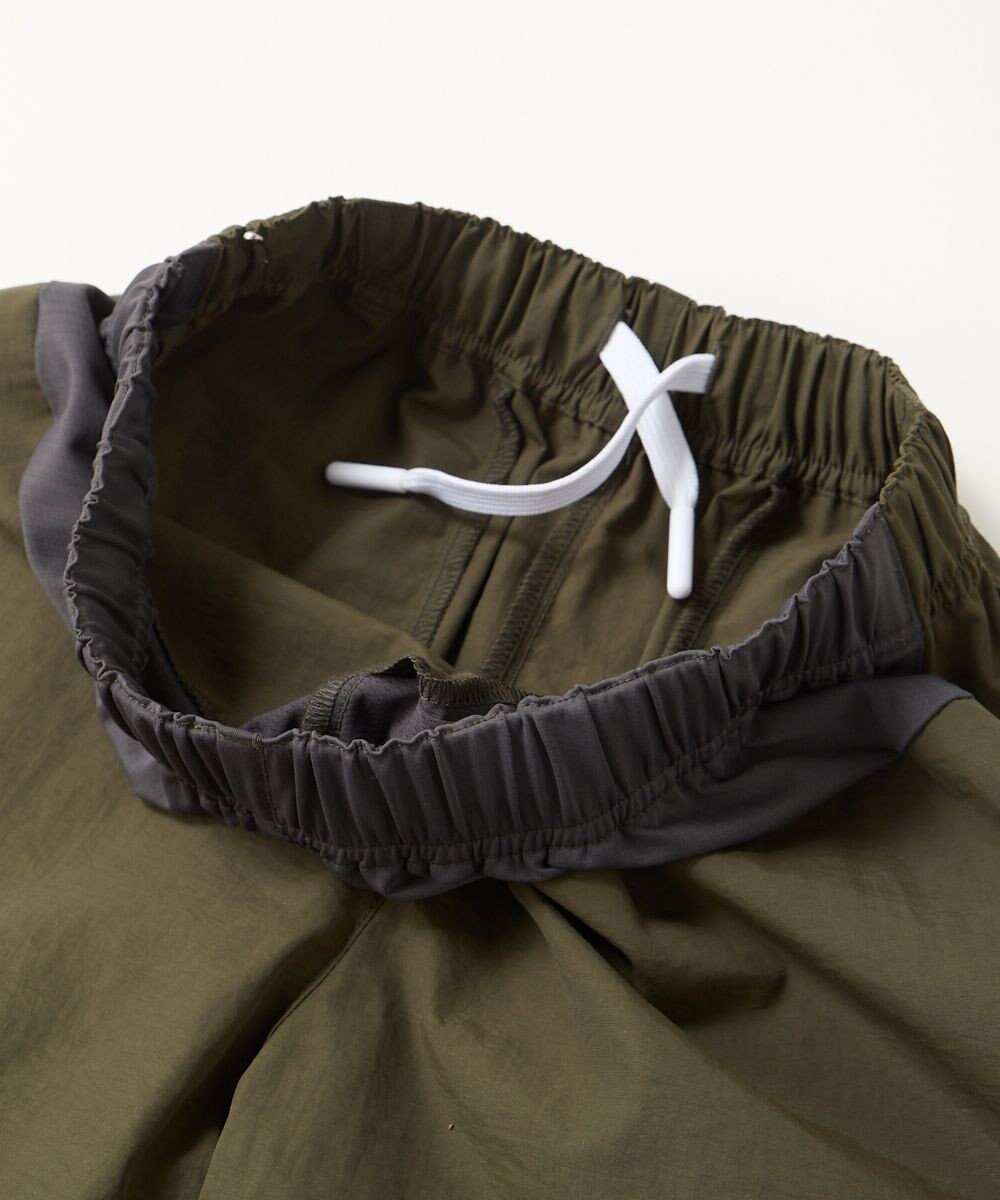 OP／FILA 【SEVEN2】異素材切替ナイロンパンツ 