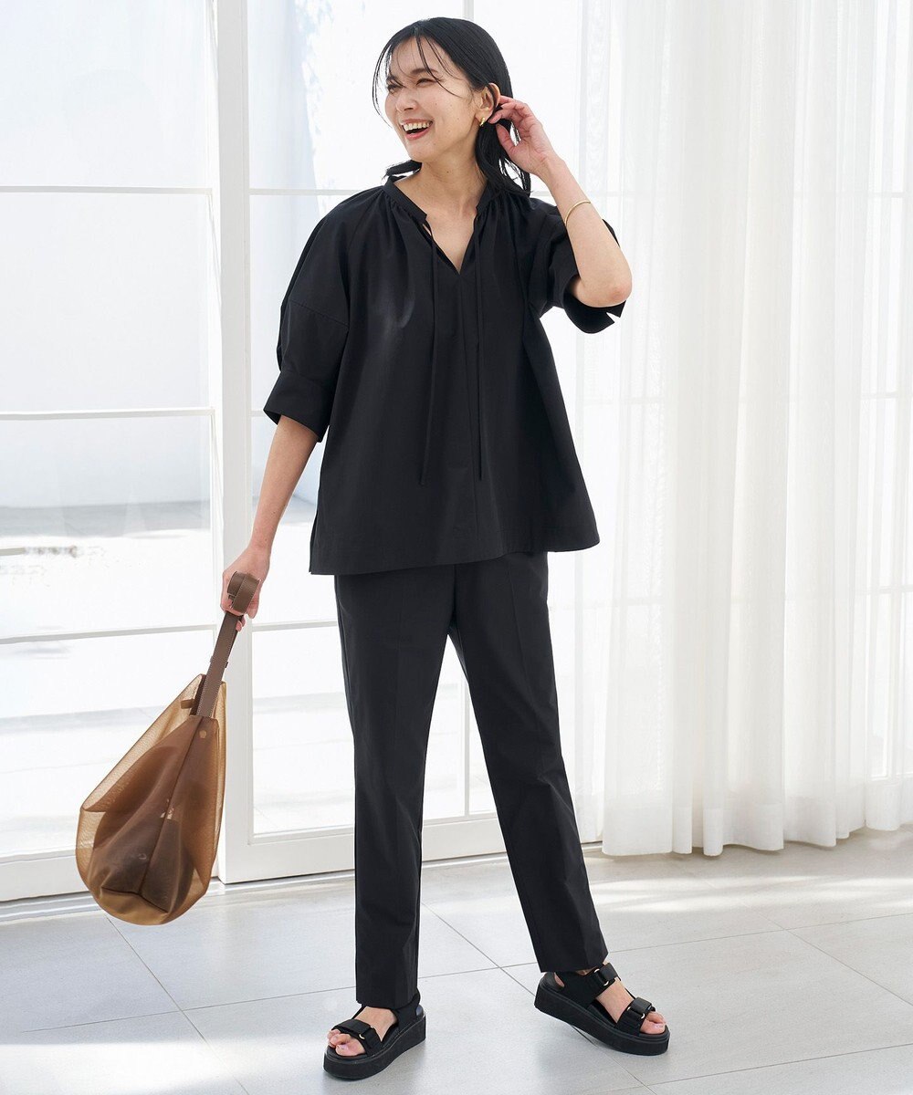 UNFILO FINE MOVE テーパードパンツ 