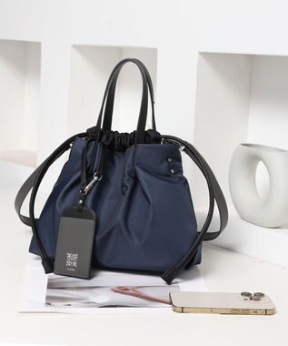 style code 【PADMA/パドマ】ナイロン×レザー　巾着　ショルダーバッグ 2WAY ネイビー