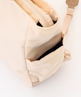 LA BAGAGERIE ツイルナイロン×エナメル リュックサック アイボリー