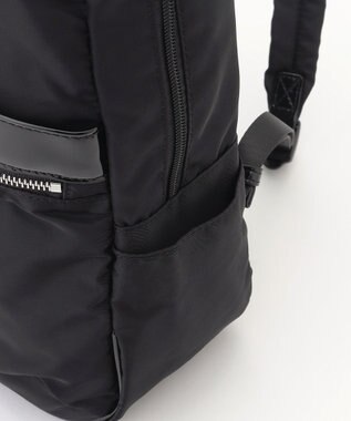 LA BAGAGERIE エナメルアクセントリュックサック ブラック