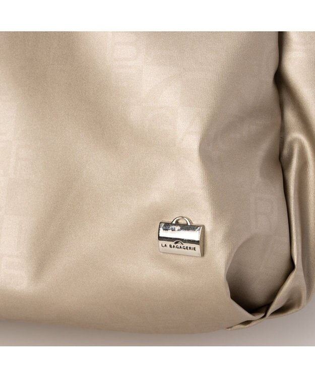 LA BAGAGERIE モノグラムデイリーバックパック ゴールド