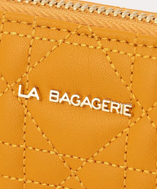 LA BAGAGERIE シープキルティング　ラウンドウォレット マスタード