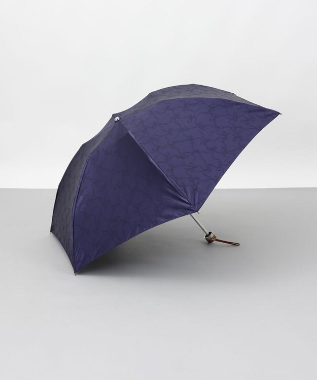 AURORA 【 NINA RICCI（ニナリッチ）】リボン柄無地ジャガード雨傘（折りたたみ傘） ネイビー