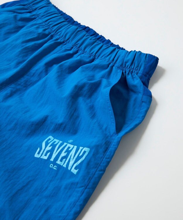 OP／FILA 【SEVEN2】異素材切替ナイロンパンツ ブルー