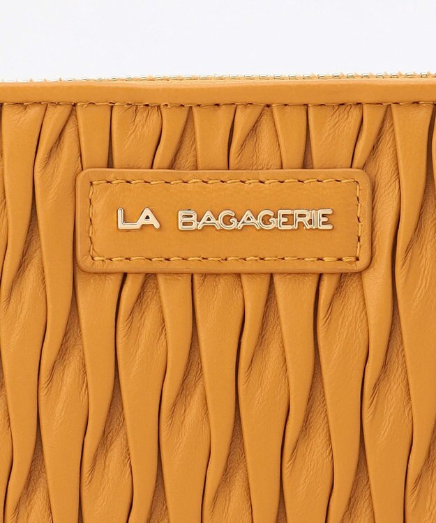 LA BAGAGERIE シープレザープリーツ加工ラウンドウォレット マスタード