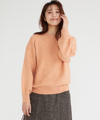 オレンジのクルーネックニット プルオーバー